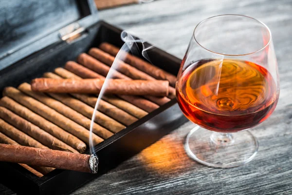 Cigars in humidor and cognac — Stock Photo, Image