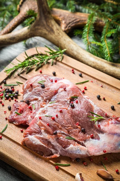 Marinating fresh meat with the rosemary — Stock Photo, Image