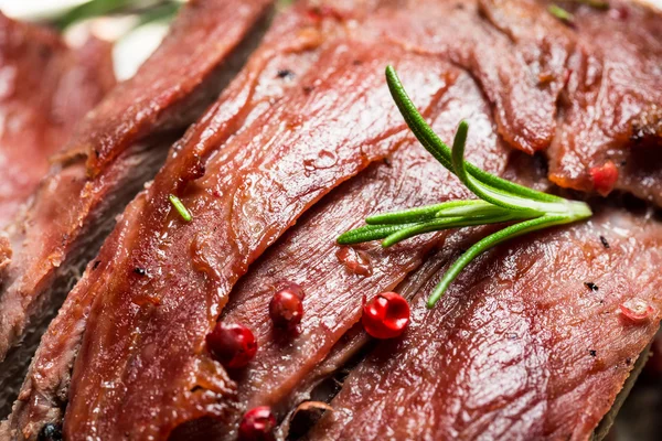 Closeup of freshly baked meat with herbs — Stock Photo, Image