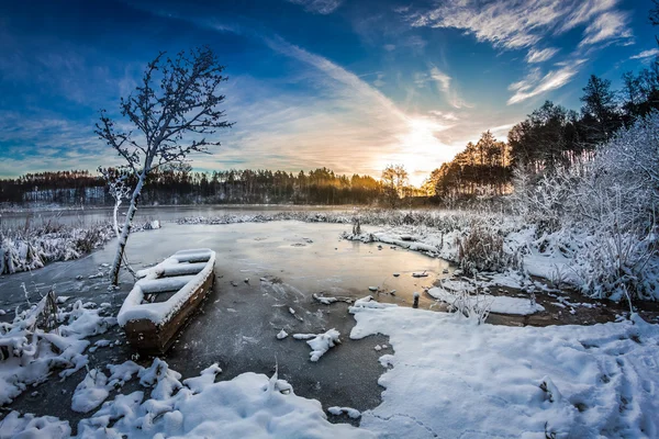 Sunrise on winter lake covered with snow — Stock Photo, Image