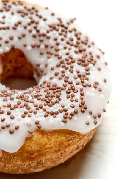 Fresh donut decorated with chocolate — Stock Photo, Image