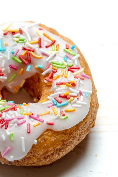 Freshly baked donut with sprinkles — Stock Photo, Image