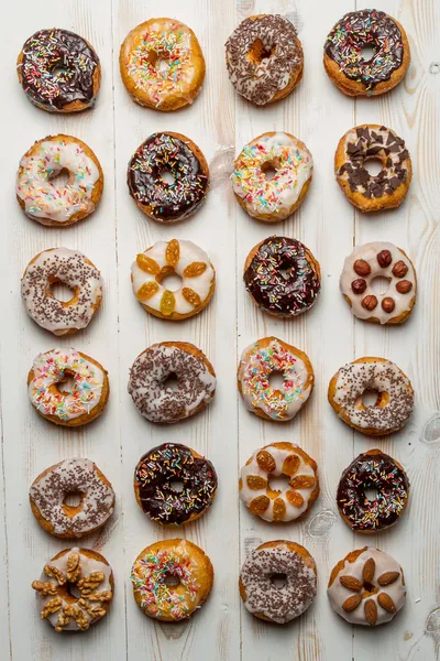 Large group of variously decorated donuts — Stock Photo, Image