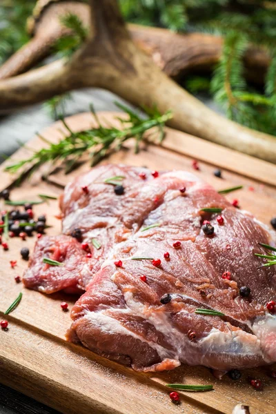 Marinating fresh meat with the rosemary — Stock Photo, Image