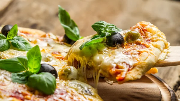 Freshly baked pizza with cheese — Stock Photo, Image