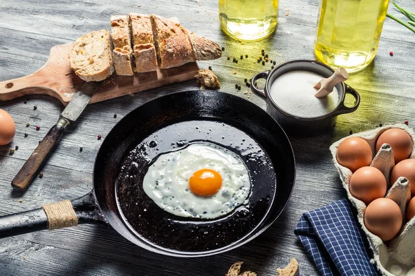 Egg on a pan served with bread — Stock Photo, Image