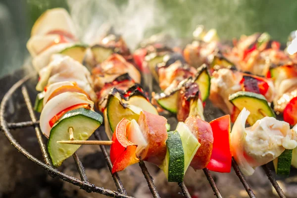 Hot skewers on the grill with fire — Stock Photo, Image