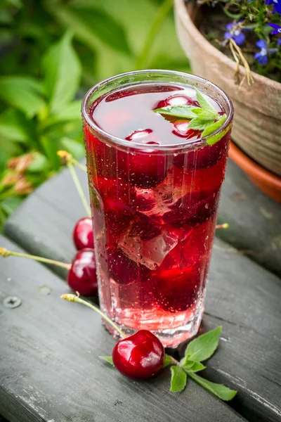 Fresh juice of sweet cherries with ice — Stock Photo, Image
