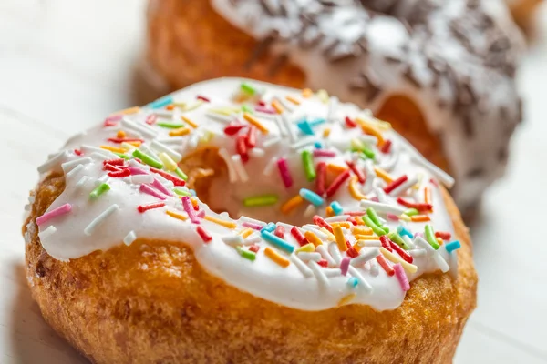 Closeup of freshly baked colorful donuts — Stock Photo, Image
