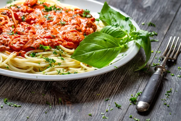 Spaghetti bolognese with seafood and basil — Stock Photo, Image