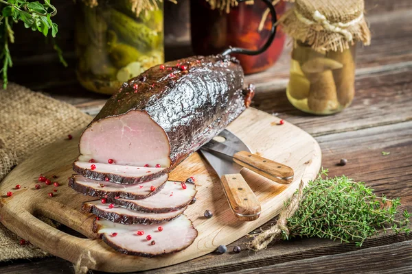 Pantry with mortars, smoked ham and  herbs — Stock Photo, Image