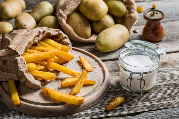 Homemade fries with salt and pepper — Stock Photo, Image