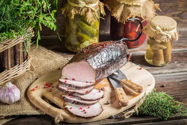 Pantry with mortars, smoked ham and  herbs — Stock Photo, Image