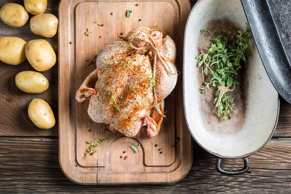 Preparation for roasting chicken with herbs — Stock Photo, Image