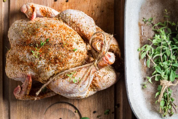 Chicken with herbs just before roasting — Stock Photo, Image