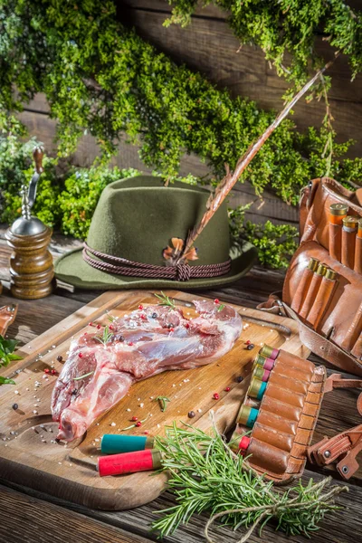 Hunting equipment and venison with herbs — Stock Photo, Image