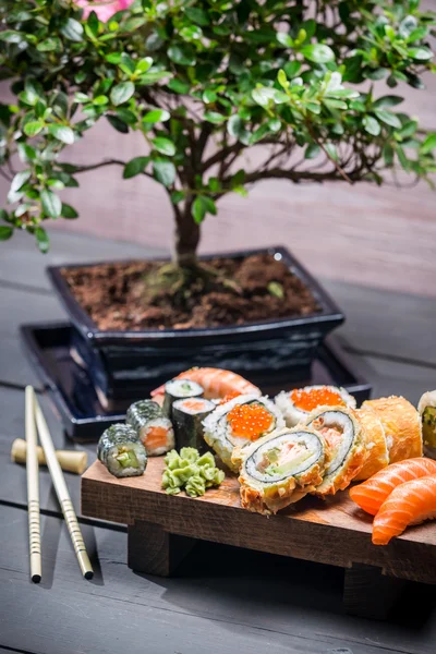 Sushi served on a wooden board and ready to eat — Stock Photo, Image