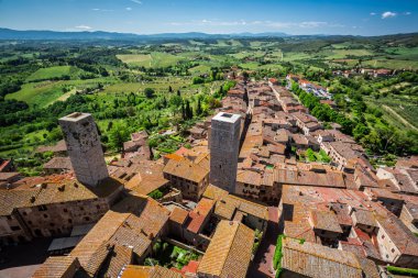 View of the red roofs and green valley in San Gimignano, Italy clipart