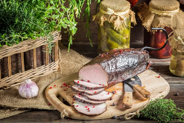 Pantry with mortars, smoked ham and  herbs — Stock Photo, Image