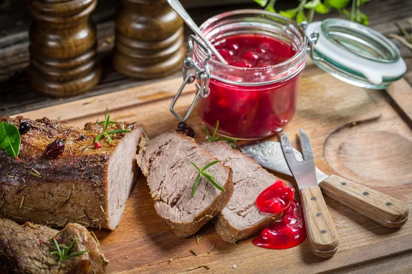 Venison served with cranberry sauce — Stock Photo, Image