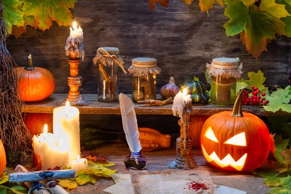Witch table with halloween pumpkin — Stock Photo, Image