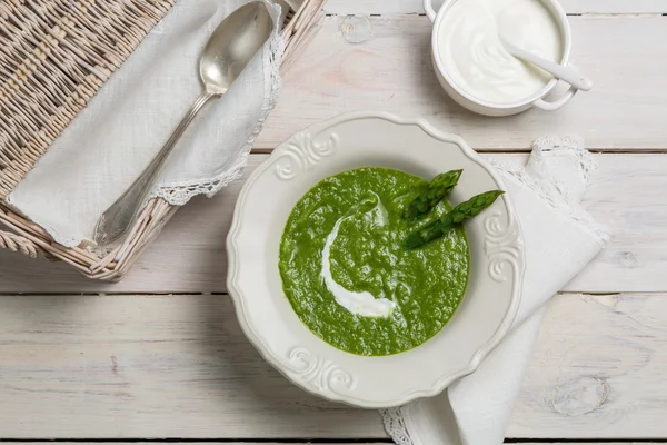 Asparagus soup with sour cream — Stock Photo, Image