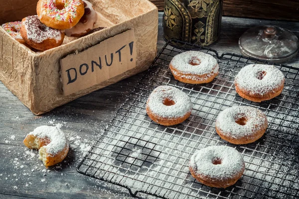 Tasting freshly baked donuts — Stock Photo, Image