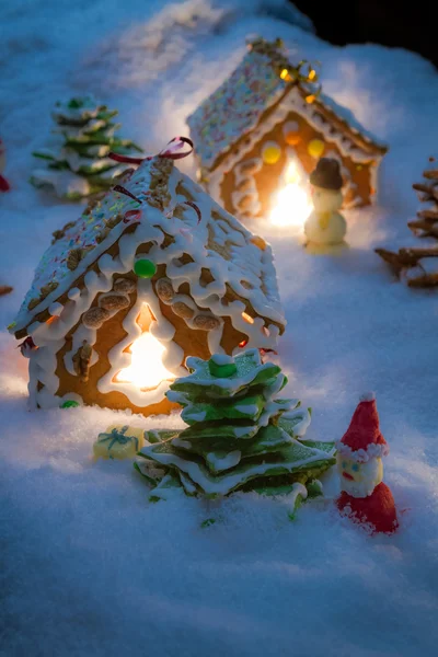 Small gingerbread houses in the snow — Stock Photo, Image