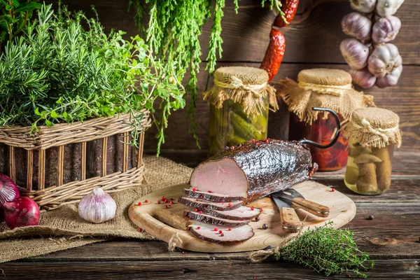 Pantry with mortars, smoked ham and  herbs — Stock Photo, Image