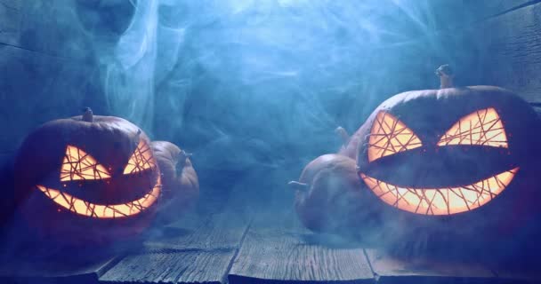 Bizarre and foggy illuminated Jack-o-lantern as darkness scene. — Stock Video