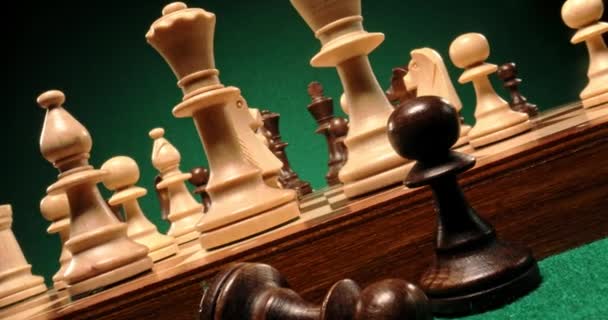 Wooden chess on white and black chessboard — Stock Video