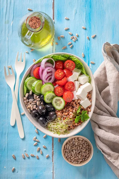 Colorful Greek salad as a balanced meal for diet. Healthy bowls on a diet.