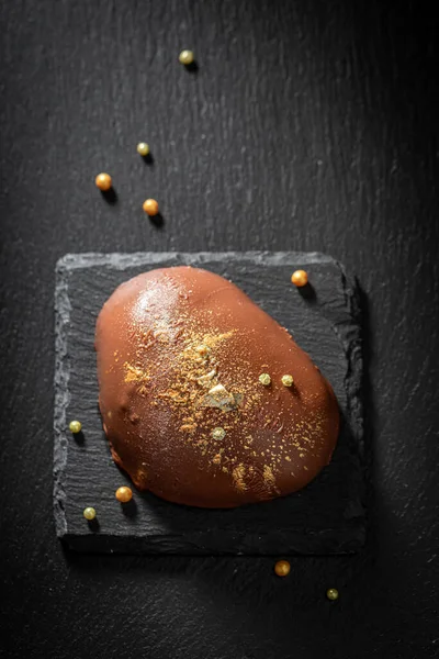 Creamy Brown Monoportion Chocolate Golden Sprinkles Black Rock — Stock Photo, Image
