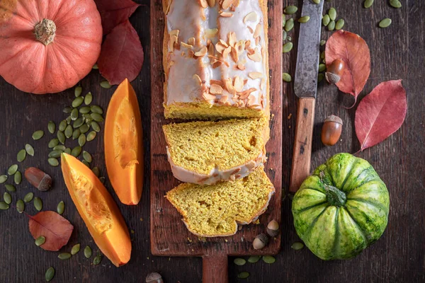 Sweet pumpkin pound cake as the perfect autumn dessert. Halloween cake made of pumpkin and spices.