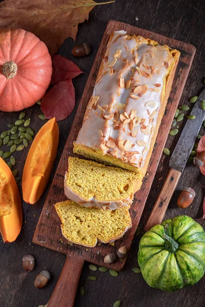 Sweet pumpkin pound cake made of vegetables and cinnamon. Halloween traditional dessert.
