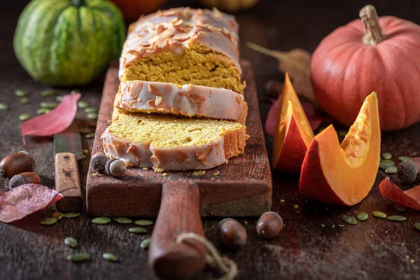 Sweet pumpkin pound cake as ready to eat fall dessert. Pumpkin bread with nuts and white chocolate.