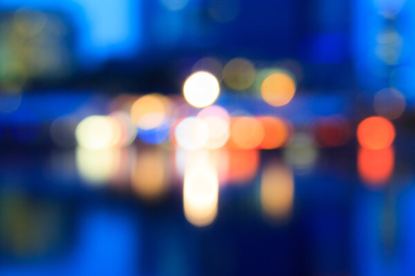Blurry city lights at a waterfront in Vienna, Austria