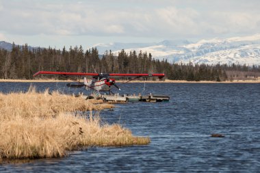 Floatplane on an Alaskan lake clipart