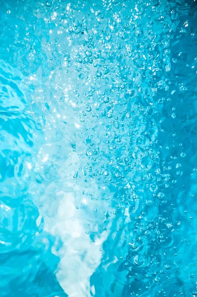 Rizos de agua de piscina y burbujas — Foto de Stock