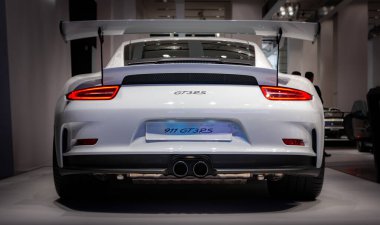 A picture of the rear view of the Porsche 911 GT3 RS, captured in an auto shop in Berlin. clipart