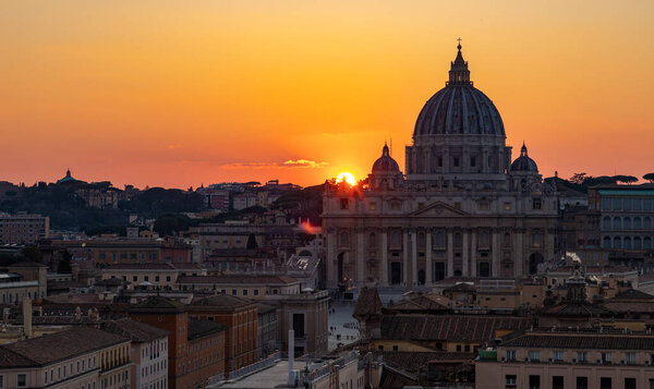 A picture of the Saint Peter's Basilica at sunset.