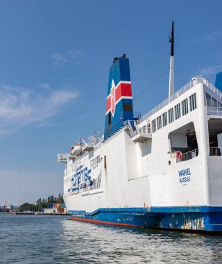 A picture of a large passenger and roll on-roll off cargo ship from Polferries docked in the Port of Gdansk.