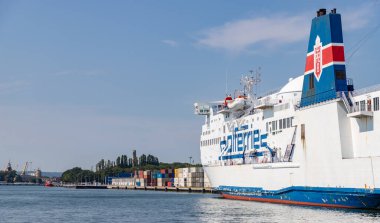 A picture of a large passenger and roll on-roll off cargo ship from Polferries docked in the Port of Gdansk.