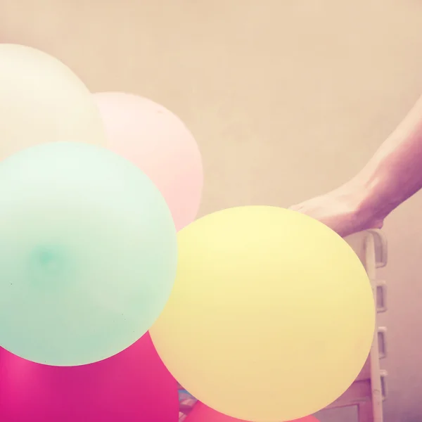 Balloons with hand — Stock Photo, Image