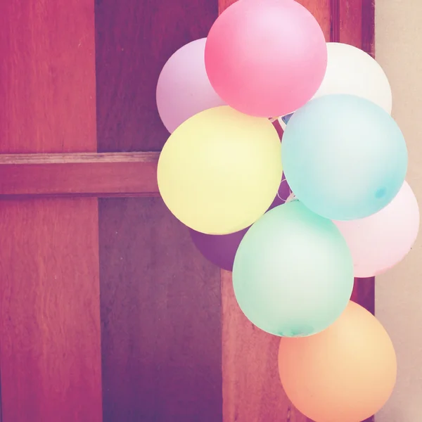 Balloons hanging on door — Stock Photo, Image