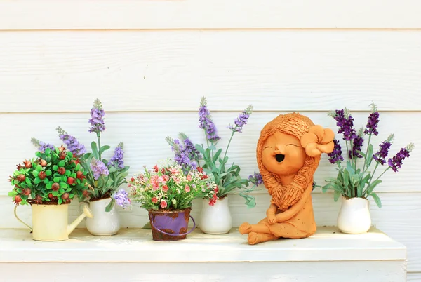 Doll clay and flower — Stock Photo, Image