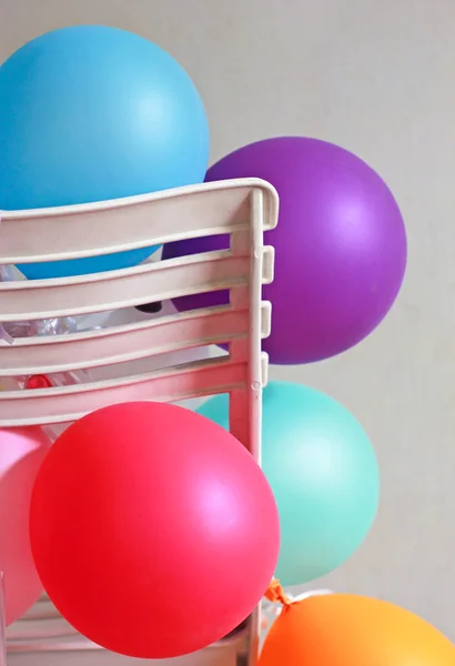 Balloons on chair — Stock Photo, Image