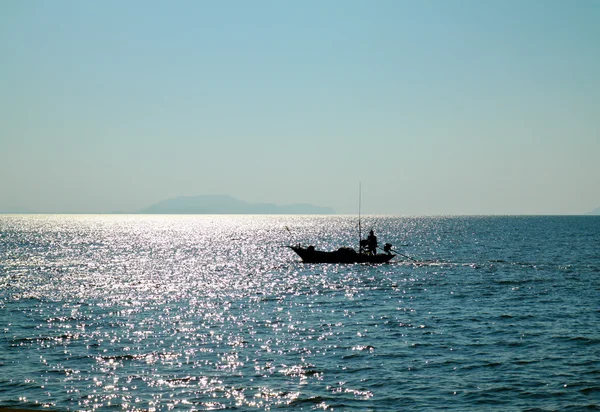 Silhouette of fisherman — Stock Photo, Image