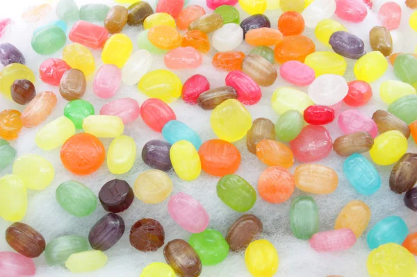 Bonbons auf Zuckerwatte Stockbild
