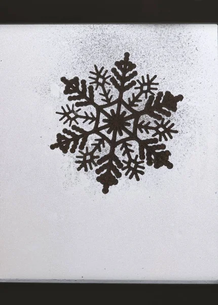 Snowflake on snow window. Christmas, snowflake, new year, pattern .